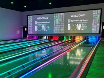 Bowl for Kids' Sake with rainbow lanes and logo on big screen